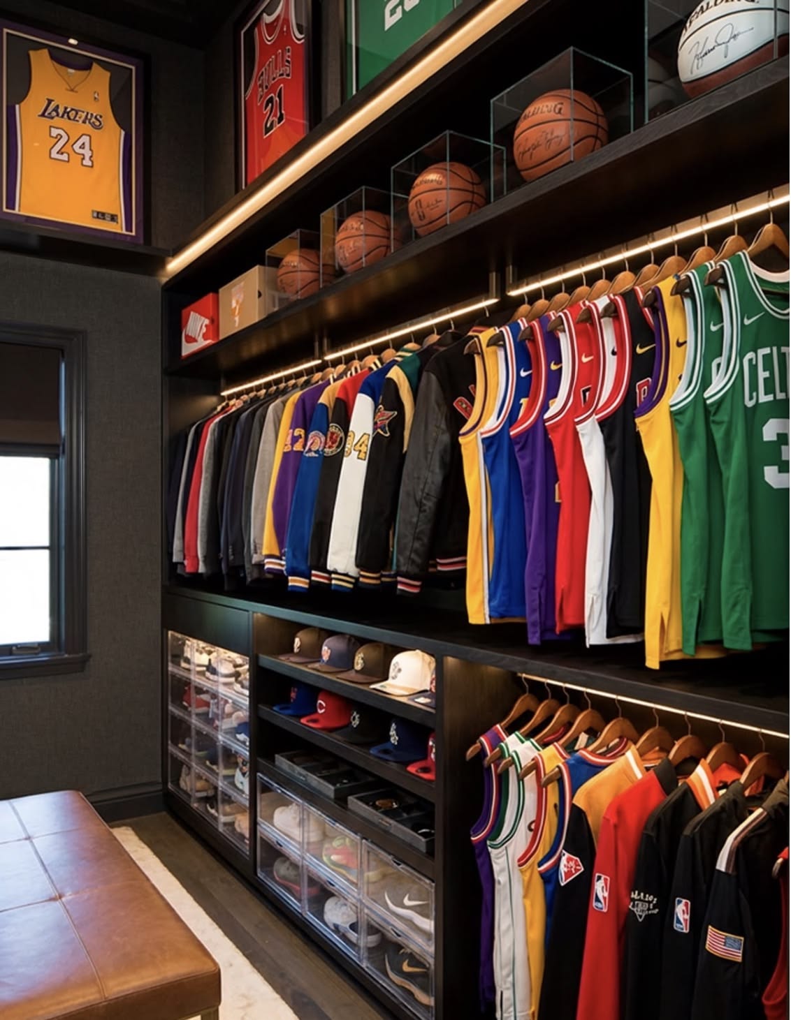 Wall of framed jerseys and sneaker boxes